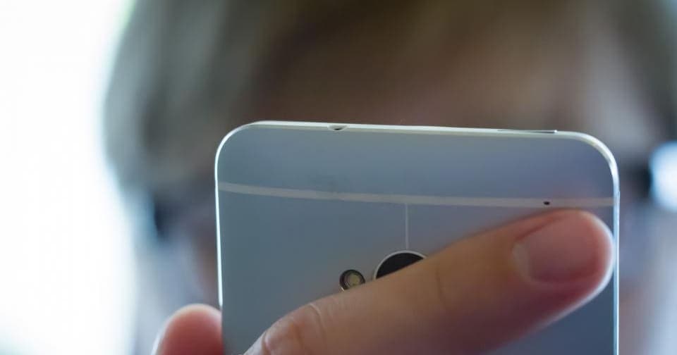 Person reading their phone screen up close